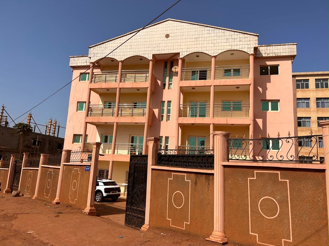 Gated entrance of the R+3 apartment building for sale in Odza, Yaoundé
