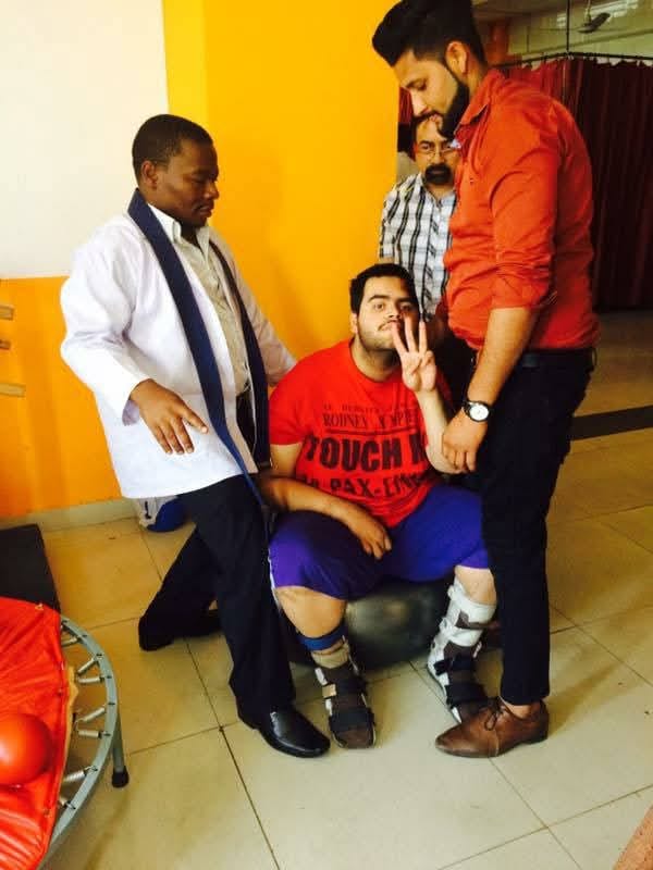 Dr. Jum Bernard guiding a patient through balance and orthotic gait rehabilitation